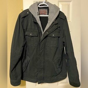 Levi’s canvas jacket with double zipper and snap closures.
